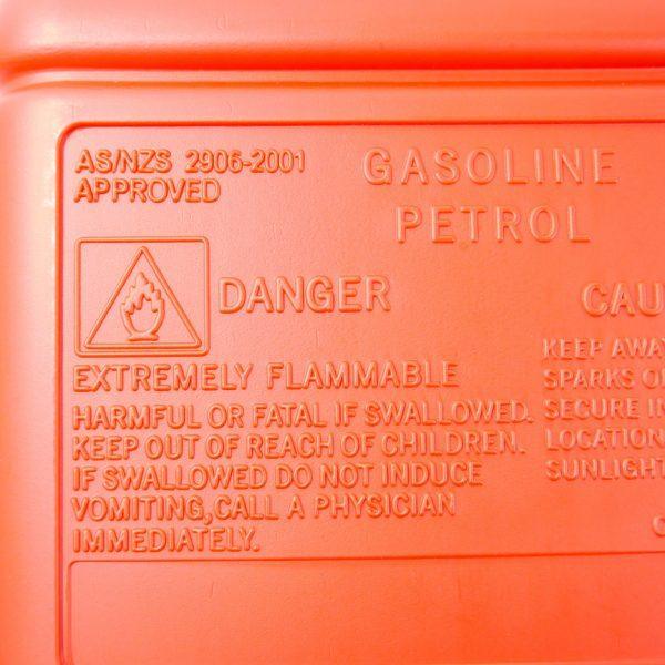 22.7L boat fuel tank with warning labels indicating safety precautions and flammability risk