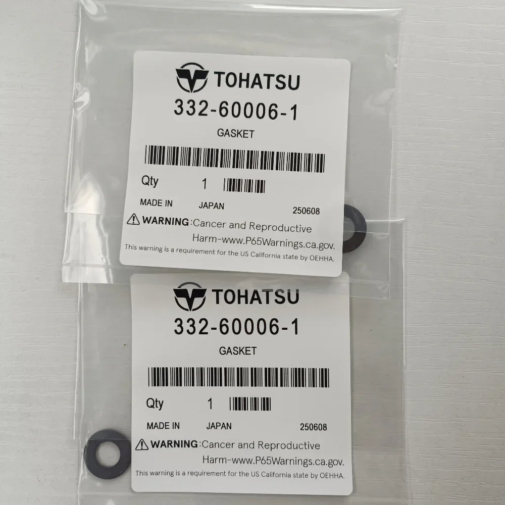 Two gaskets in a clear plastic bag with Tohatsu labels on a white background