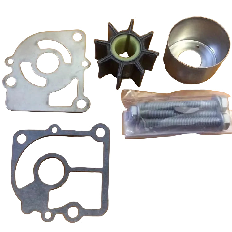 Mechanical parts including a gasket, metal washer, and other components on a wooden surface
