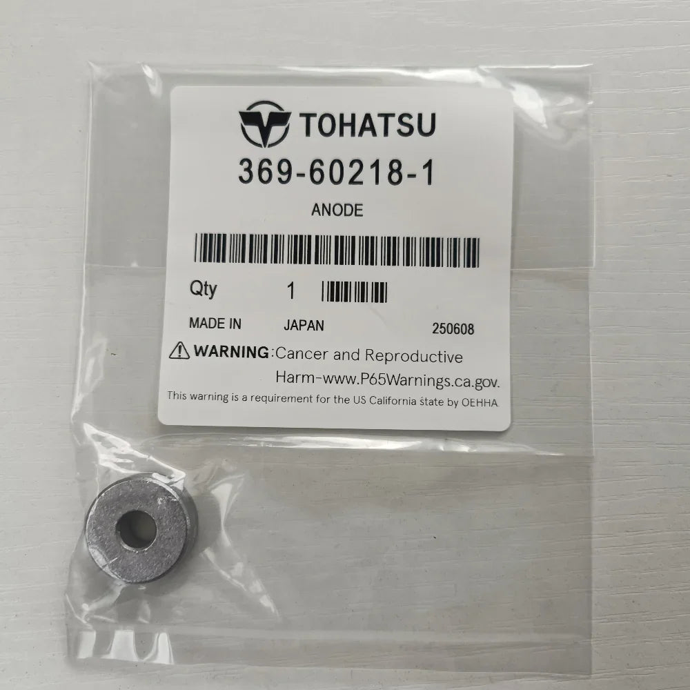 Tohatsu anode in packaging with label on a gray background