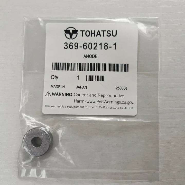Tohatsu anode in packaging with label on a gray background