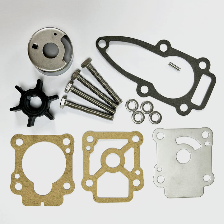 Collection of mechanical parts including gaskets and screws on a white background