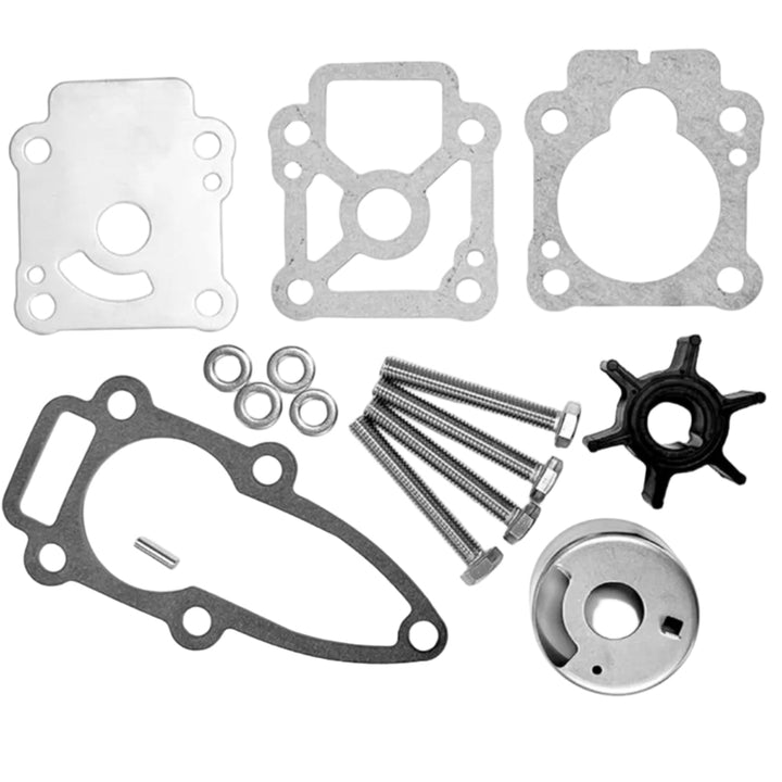 Set of mechanical parts including gaskets, screws, and a impeller on a white background