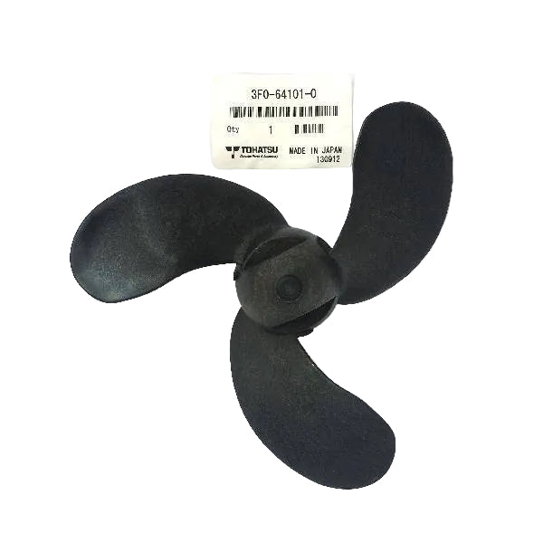 A black three-blade propeller part with a central hub, shown next to its white product label on a clear plastic bag, photographed against a white background.