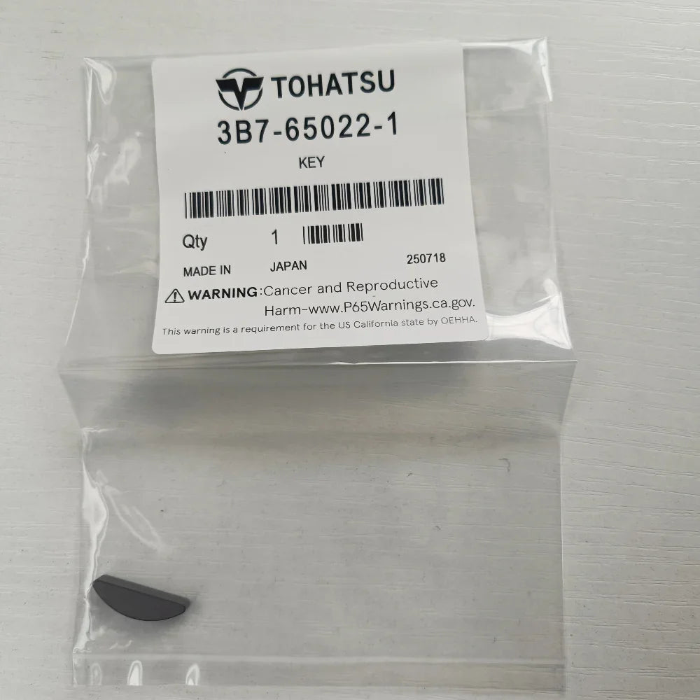 Packaged key with Tohatsu label on a white background