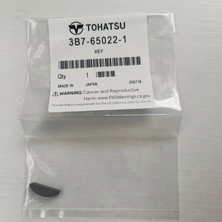 Packaged key with Tohatsu label on a white background