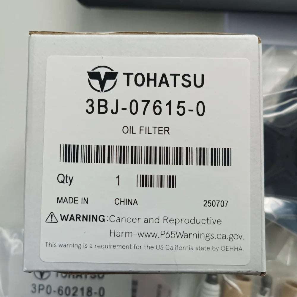 Tohatsu oil filter packaging with label on a blurred background