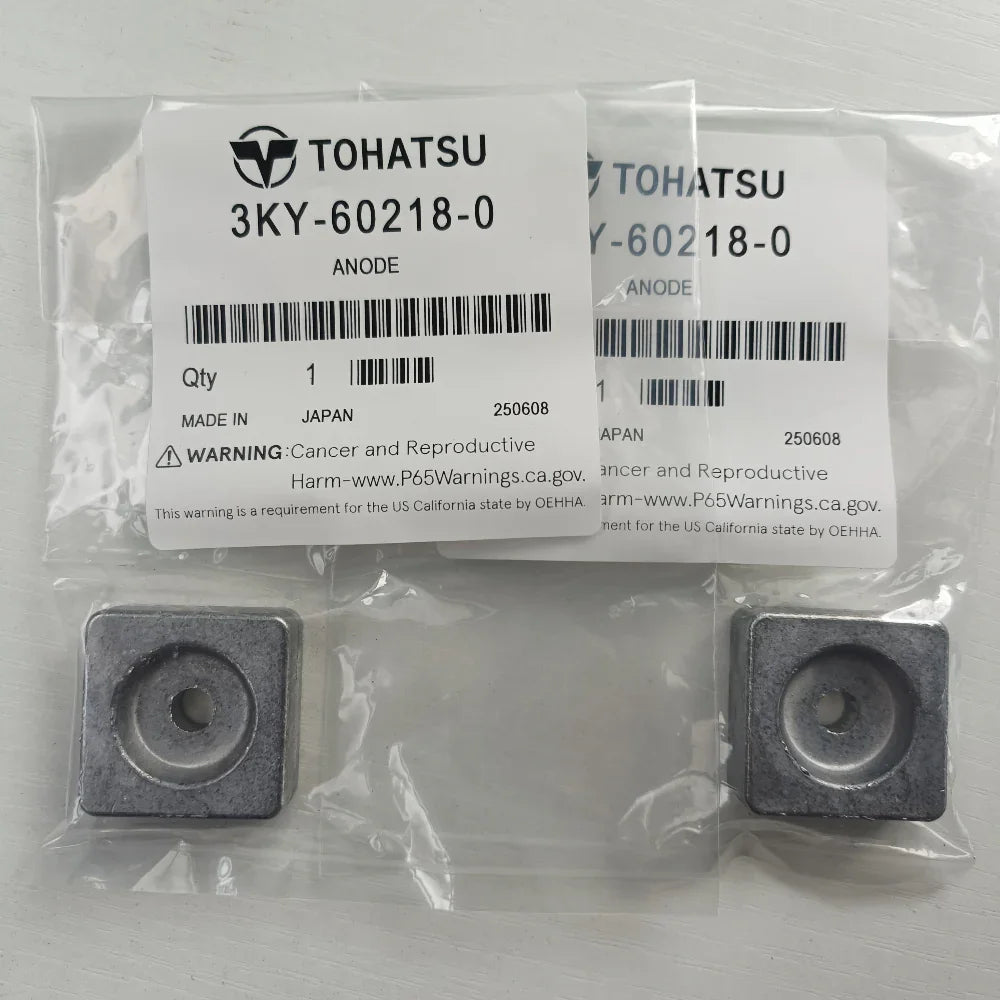 Two metallic anodes in clear packaging with Tohatsu labels on a light gray background