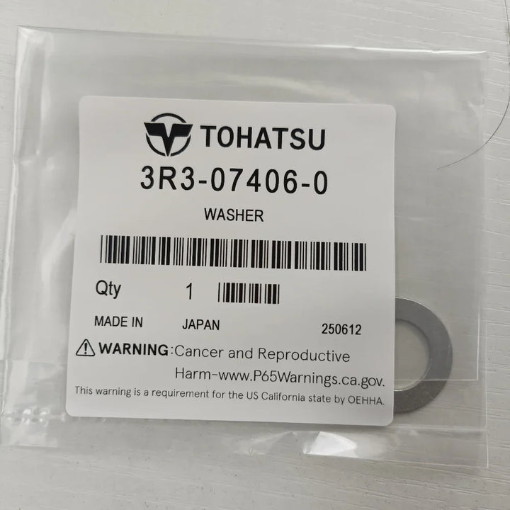 Tohatsu washer packaging with label and washer inside a clear plastic bag.