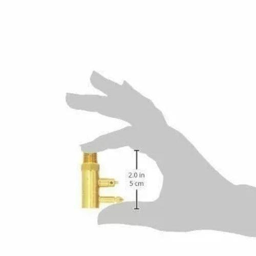 Brass male fuel tank connector held in hand for size reference, featuring durable construction