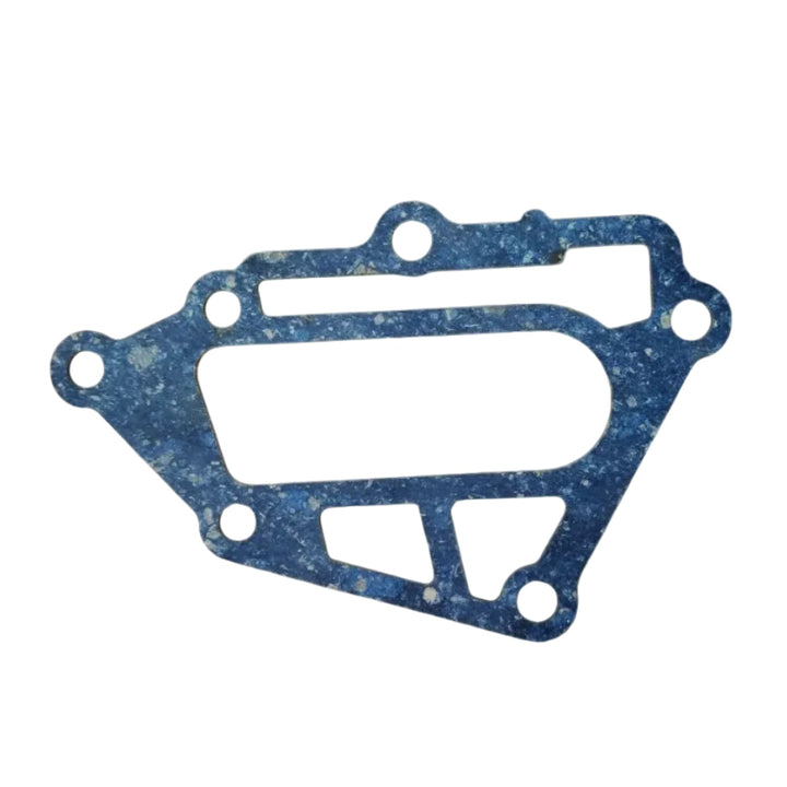 A blue spark-platter-shaped gasket with cutouts, shown on a light blue gradient background with Russian text, a TONATSU label, and an OEM part number. A small TONATSU logo is visible at the top right.