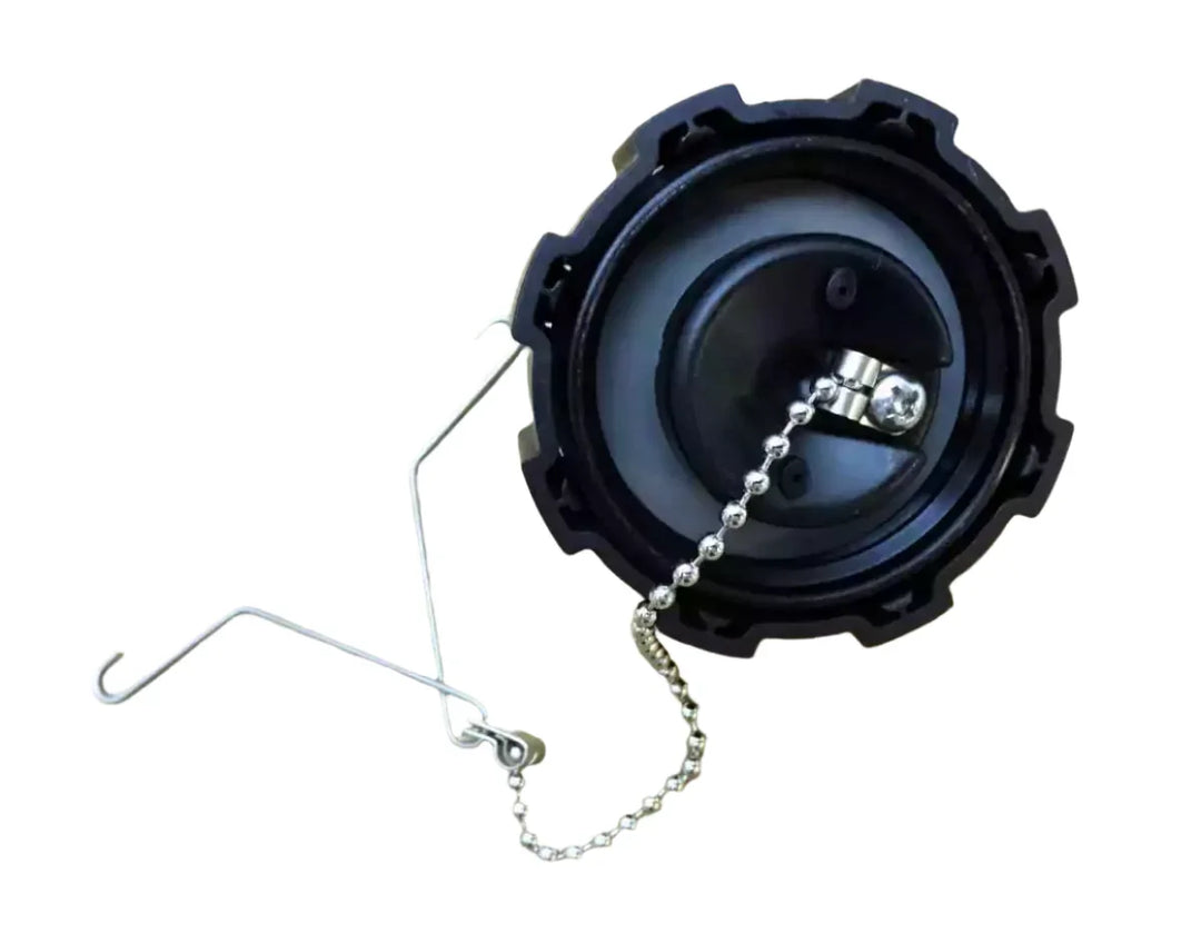 Black cap with chain on a beige background